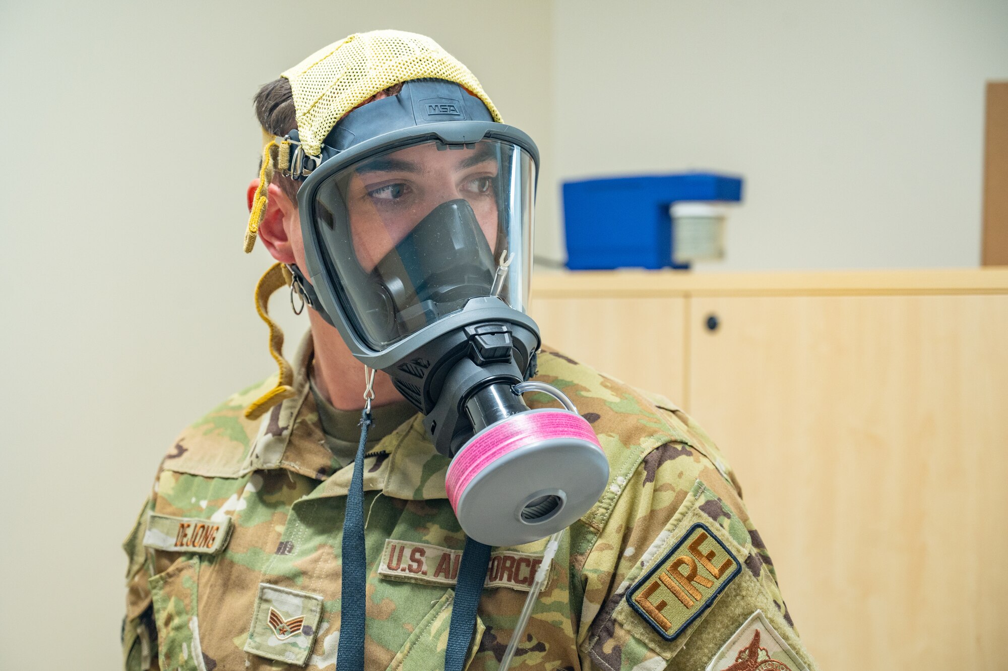 A U.S. Airman assigned to the 156th Wing, tests a gas mask during an exercise Aug. 9, 2024, at Muñiz Air National Guard Base, Carolina, Puerto Rico. The exercise is part of the 125th Medical Group’s training that enhances air-load capabilities, refines pre- and post- deployment procedures, expands mission readiness in an unfamiliar environment, and fulfills Comprehensive Medical Readiness Plan requirements, including critical care, search and extraction, and Air Force Specialty Code proficiency training, while collaborating with the 156th Medical Group. The exercise also includes providing Individual Medical Readiness support for members of the 156th Wing population. (U.S. Air National Guard photo by Senior Airman Jesse Hanson)