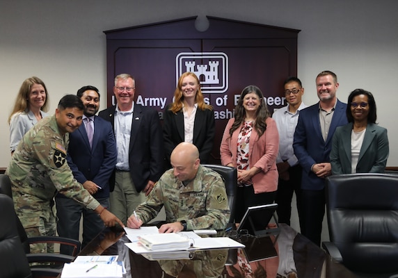 Lt. Gen. Scott Spellmon signs Miami Dade CSRM Chief's Report