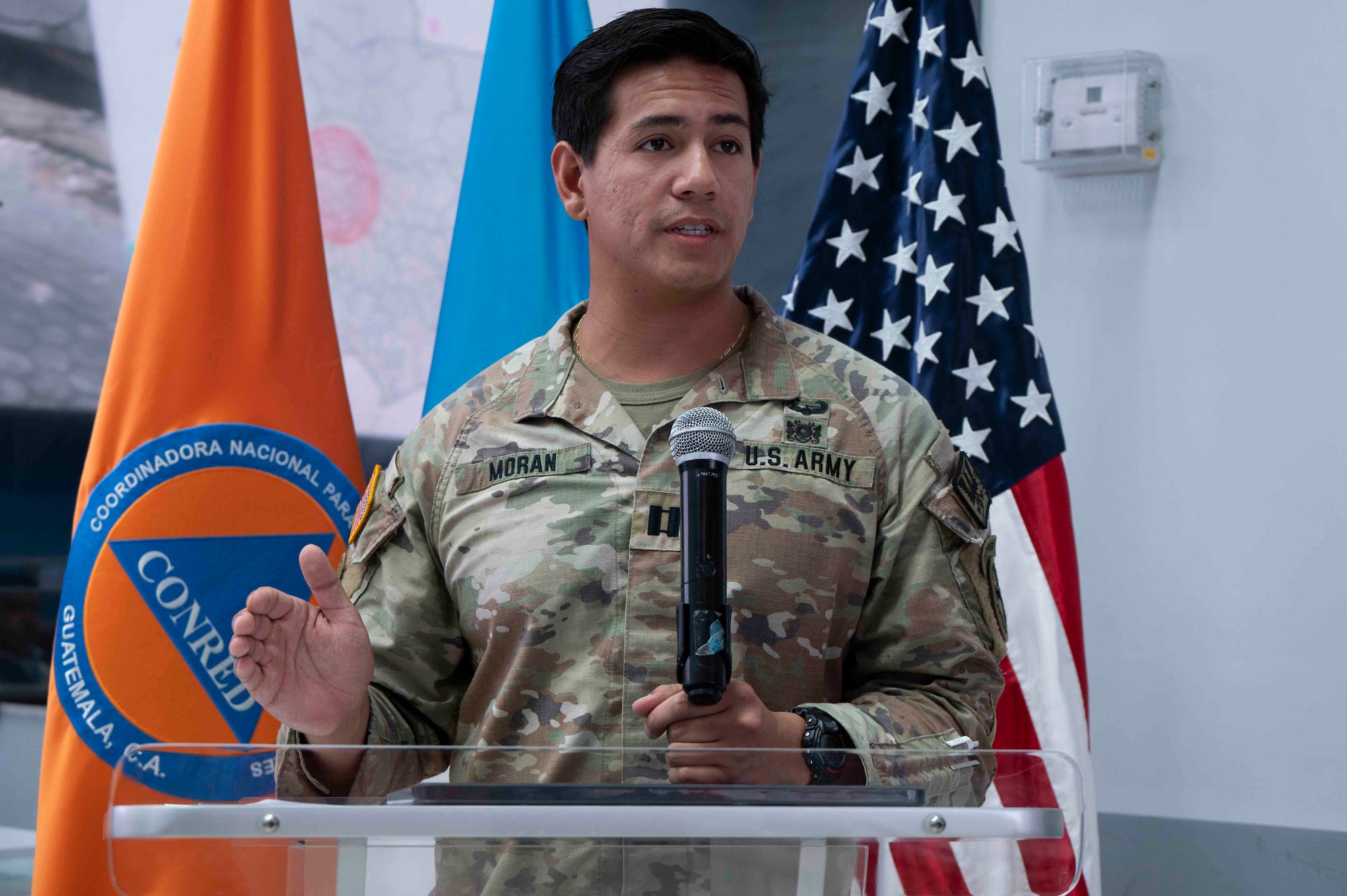 A photo of a Solider talking at a podium.