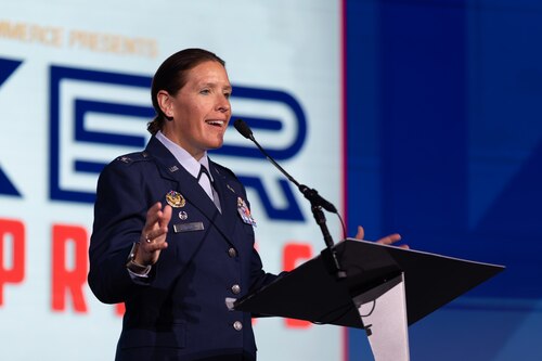 Woman speaking on stage