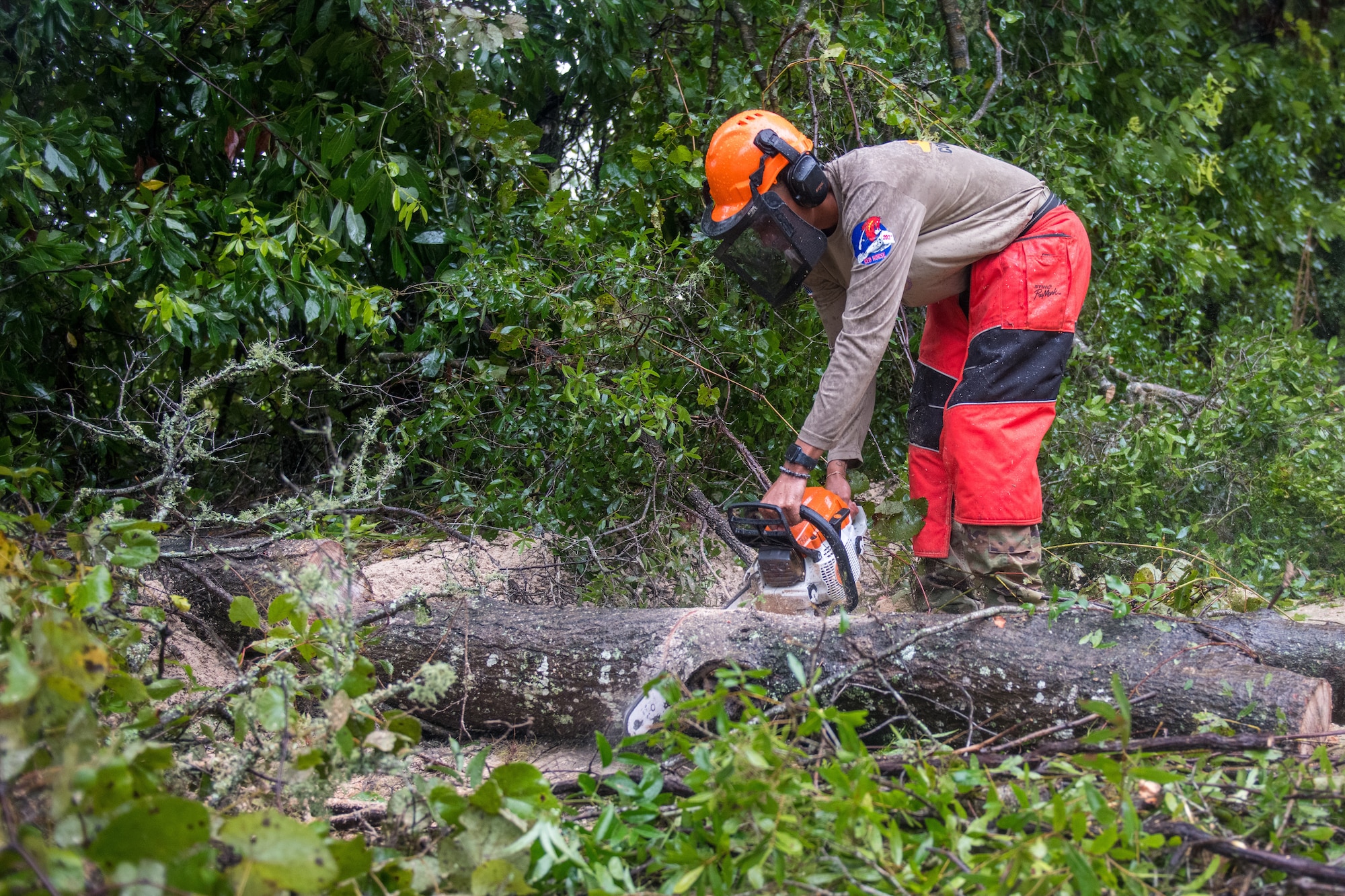 U.S. Airmen assigned to the 202nd Rapid Engineer Deployable Heavy Operational Repair Squadron Engineers (RED HORSE) Squadron, Florida Air National Guard, clear roads in Gilchrist county, Florida, after Hurricane Debby, Aug. 5, 2024. The 202nd RED HORSE Squadron, stationed at Camp Blanding, Florida, is a specialized, highly mobile civil engineering team comprised of Florida Air National Guardsmen that provides rapid response capabilities for multiple worldwide contingencies and operations. (U.S. Air National Guard photo by Staff Sgt. Jacob Hancock)