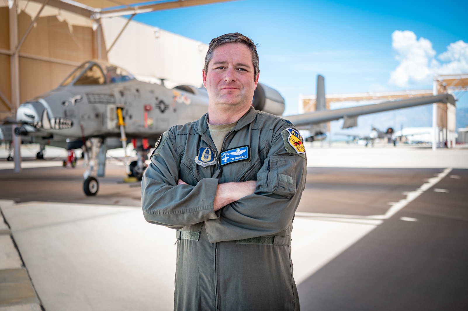 U.S. Air Force Reserve Citizen Airman Lt. Col. Timothy “Scream” Mitchell, an A-10 instructor pilot and flight commander with the 47th Fighter Squadron, stands in front of the first A-10C Thunderbolt II he flew, tail number 9154, on the flight line at Davis-Monthan Air Force Base, Ariz., Aug. 22, 2024. Mitchell, a veteran A-10 pilot, was recently recognized with a safety award for his quick-thinking actions during an in-flight emergency, underscoring the critical importance of the Warthog in close air support operations. (U.S. Air Force photo by Tech. Sgt. Tyler J. Bolken)