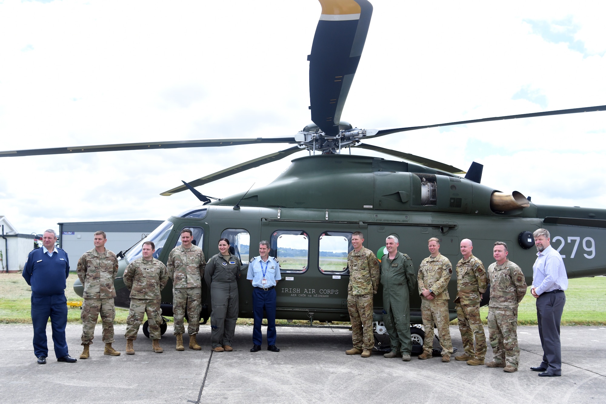 U.S. Air Force members pose for a photo with members of the Irish Air Corps during a tour of Casement Aerodrome in Baldonnel, Ireland, June 22, 2024. Airmen from Twentieth Air Force and Air Force Global Strike Command visited with the IAC June 22-29, 2024 to discuss a mutually beneficial partnership with exchanges of personnel to provide U.S. pilots with training in the AW-139 by experienced instructors at Casement Aerodrome in Baldonnel and provide Irish pilots with an experience flying in mountainous terrain through the High Alpine Advanced Flying Technique course at Malmstrom Air Force Base, Montana.
