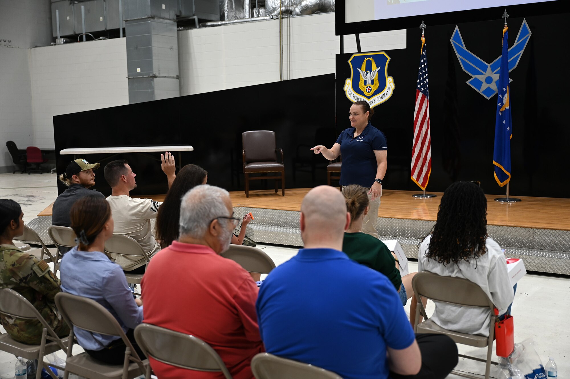 Master Sgt. Michelle Shutler, 445th AW health professional recruiter, answers a question by a potential recruit during the 445th Airlift Wing health professions recruiting event Aug. 3, 2024. The event allowed participants to speak with flight nurses, learn about the three medical squadrons of the 445th – 445th Aeromedical Evacuation,445th Aeromedical Staging and 445th Aerospace Medicine Squadrons, and have their questions answered about the medical career field.