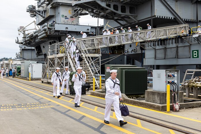 Sailors depart USS Ronald Regan (CVN 76), Aug. 13, 2024, after arriving at their new homeport on Naval Base Kitsap-Bremerton-Washington. (U.S. Navy photo by Jeb Fach)