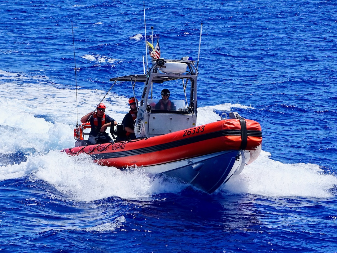 The crew of the USCGC Frederick Hatch (WPC 1143) return from a boarding on July 31, 2024, on the high seas of the Pacific Ocean. During this patrol, the Frederick Hatch team boarded two foreign-flagged fishing vessels in the Western and Central Pacific Fisheries Commission (WCPFC) operational area on the high seas, with no violations reported, ensuring the safety and security of the region's maritime activities. (U.S. Coast Guard photo)