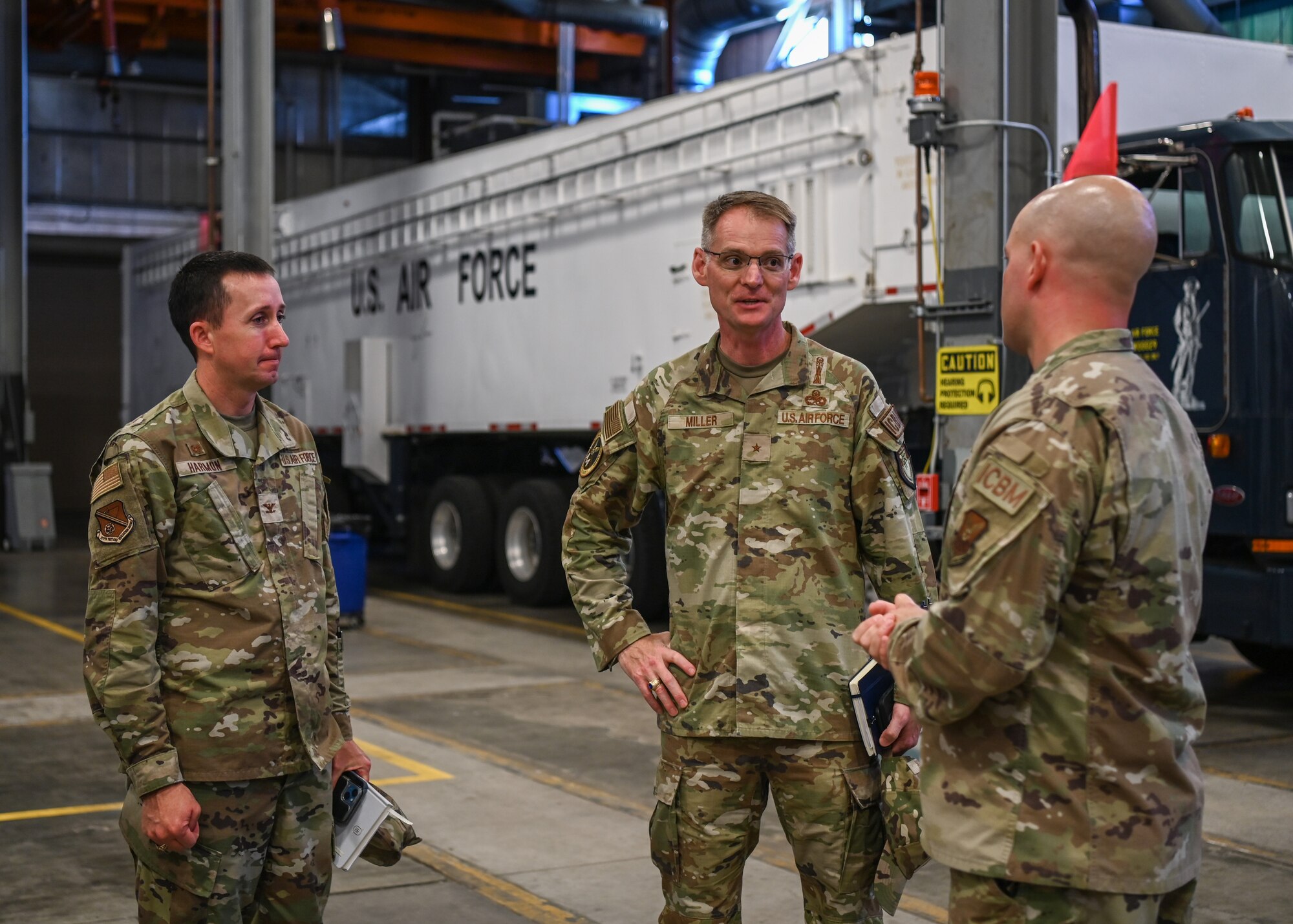 An Air Force Global Strike Command logistics and engineering director, 377th Flight Test Missile Maintenance Squadron generation flight chief, and 377th Test and Evaluation Group commander, speaks about launch capabilities during a tour of the 377 FTMMXS at Vandenberg Space Force Base.