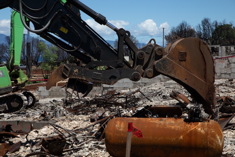 USACE contractors clearing wildfire ash and debris from a residential property in Lahaina, Hawaii.