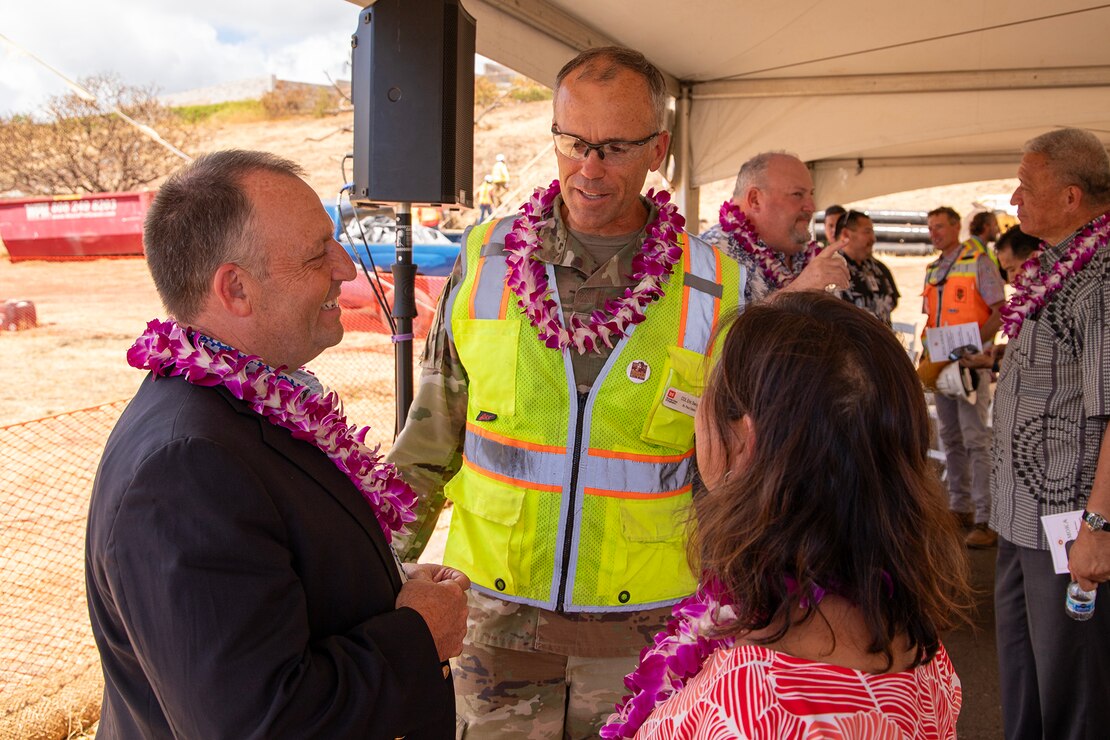 Hawaii Gov. Josh Green (front left) and First Lady Jaime Green (right) speak with Col. Eric Swenson, commander of the U.S. Army Corps of Engineers Recovery Field Office, following a ground blessing ceremony on Aug. 9. The ceremony marked the start of a sewer line project at the Kilohana Temporary Group Housing site in Lahaina, a significant infrastructure improvement for the community.