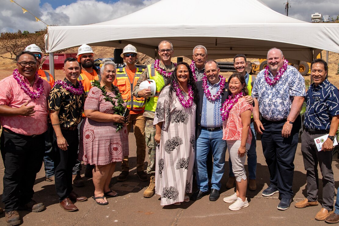 Attendees, including Hawaii Gov. Josh Green (front center), First Lady Jaime Green (front right), Maui Mayor Richard Bissen (back center), First Lady Isabella Bissen (front left), FEMA Region 9 Administrator Robert Fenton (back, second from right), and Col. Eric Swenson, commander of the U.S. Army Corps of Engineers Recovery Field Office (back center-left), pose for a group photo during a ground blessing ceremony on Aug. 9 in Lahaina. The event marked the beginning of a sewer line project at the Kilohana Temporary Group Housing site, a vital step in Maui’s recovery.