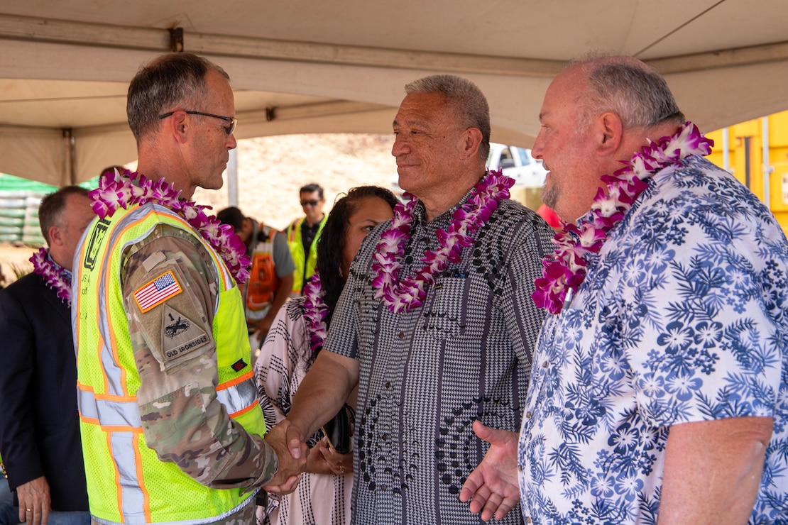 Col. Eric Swenson, commander of the U.S. Army Corps of Engineers Recovery Field Office (front left), speaks with Maui Mayor Richard Bissen and FEMA Region 9 Administrator Robert Fenton following a ground blessing ceremony on Aug. 9 in Lahaina. The event marked the beginning of a sewer line installation at the Kilohana Temporary Group Housing site, a crucial step in the recovery process, benefiting the community with a more sanitary and environmentally friendly public sewer system.