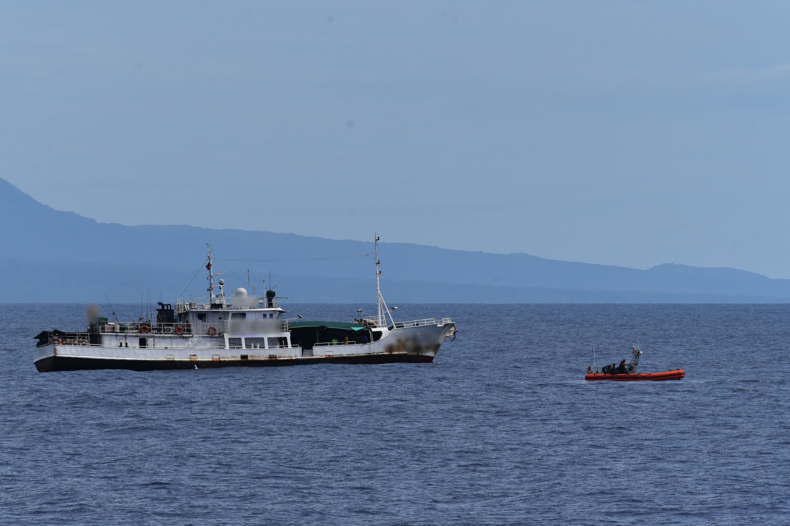 Samoan shipriders and a law enforcement team from U.S. Coast Guard Cutter Harriet Lane (WMEC 903) prepare to board a foreign-flagged fishing vessel in Samoa’s exclusive economic zone July 14, 2024. Through bilateral maritime law enforcement agreements, the Coast Guard provides a platform for partner nations to enforce domestic and international laws within territorial seas and the far reaches of their EEZs. (U.S. Coast Guard photo, courtesy Cutter Harriet Lane)