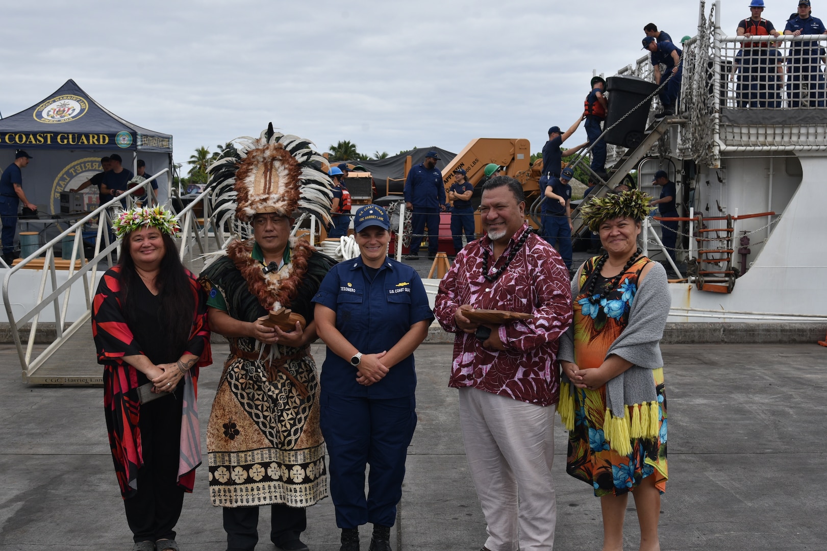 U.S. Coast Guard Cmdr. Nicole Tesoniero, commanding officer of Cutter Harriet Lane (WMEC 903), poses for a photo with Cook Islands representatives after the Harriet Lane crew’s arrival to Rarotonga, Cook Islands, Aug. 2, 2024. The Harriet Lane crew made a port call in Rarotonga as part of their 68-day, 13,400-mile patrol supporting Operation Blue Pacific. (U.S. Coast Guard photo, courtesy Cutter Harriet Lane)