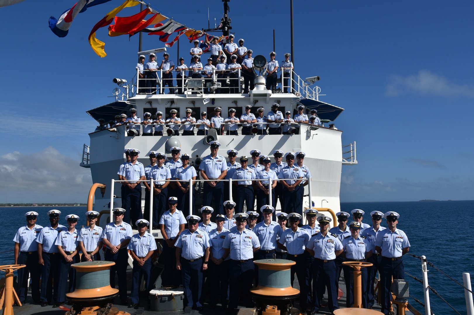 The crew of U.S. Coast Guard Cutter Harriet Lane (WMEC 903), a 270-foot medium endurance cutter homeported in Honolulu, Hawaii, poses for a photo following the Royal Tongan Navy’s International Fleet Review in Nuku’alofa, Tonga, July 4, 2024. The U.S. Coast Guard participated in the review to celebrate King Tupou VI's 65th birthday and the 50th anniversary of the Tongan Navy. (U.S. Coast Guard photo, courtesy Cutter Harriet Lane)