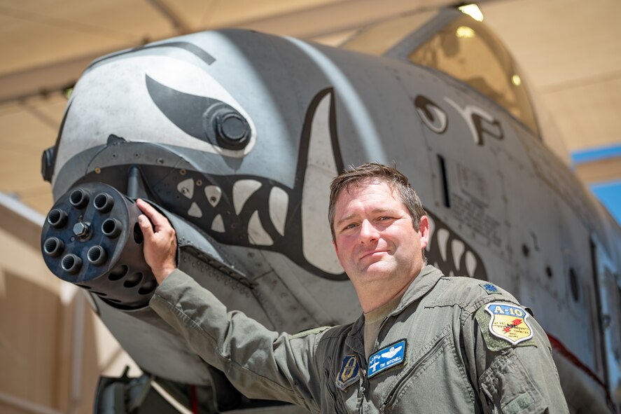 U.S. Air Force Reserve Citizen Airman Lt. Col. Timothy “Scream” Mitchell, an A-10 instructor pilot and flight commander with the 47th Fighter Squadron, places his hand on the iconic nose of an A-10C Thunderbolt II at Davis-Monthan Air Force Base, Ariz., Aug. 22, 2024. The A-10, known for its distinctive design and close air support capabilities, has been central to Mitchell’s career. (U.S. Air Force photo by Tech. Sgt. Tyler J. Bolken)