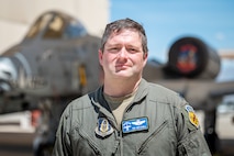 U.S. Air Force Reserve Citizen Airman Lt. Col. Timothy “Scream” Mitchell, an A-10 instructor pilot and flight commander with the 47th Fighter Squadron, stands in front of an A-10C Thunderbolt II adorned with its unique “Warthog” nose art at Davis-Monthan Air Force Base, Ariz., Aug. 22, 2024. The aircraft’s distinctive markings and Mitchell’s long tenure as a pilot underscore the deep connection between the A-10 and those who fly and maintain it. (U.S. Air Force photo by Tech. Sgt. Tyler J. Bolken)