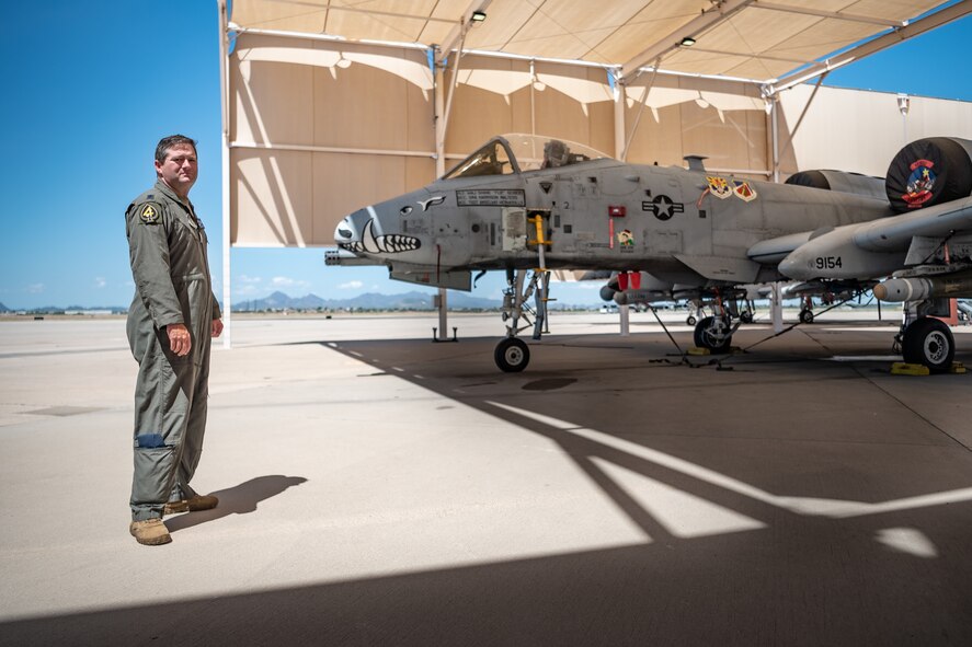U.S. Air Force Reserve Citizen Airman Lt. Col. Timothy “Scream” Mitchell, an A-10 instructor pilot and flight commander with the 47th Fighter Squadron, stands in front of the first A-10C Thunderbolt II he flew, tail number 9154, on the flight line at Davis-Monthan Air Force Base, Ariz., Aug. 22, 2024. Mitchell has flown the A-10, often referred to as the Warthog, for nearly two decades, exemplifying the dedication and expertise that define the A-10 community. (U.S. Air Force photo by Tech. Sgt. Tyler J. Bolken)