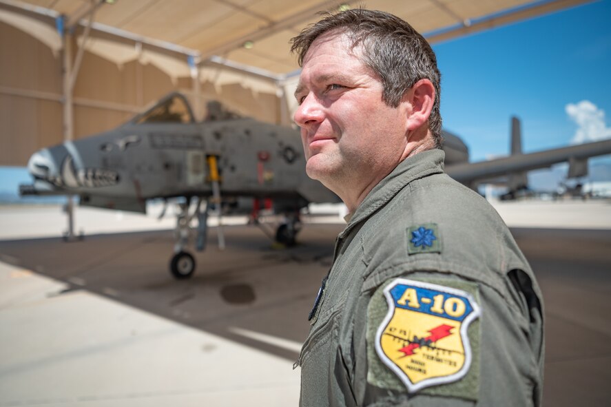 U.S. Air Force Reserve Citizen Airman Lt. Col. Timothy “Scream” Mitchell, an A-10 instructor pilot and flight commander with the 47th Fighter Squadron, reflects on his career as he stands beside an A-10C Thunderbolt II at Davis-Monthan Air Force Base, Ariz., Aug. 22, 2024. With the A-10's service in the U.S. Air Force nearing its end, Mitchell’s experiences and legacy highlight the impact of this storied aircraft. (U.S. Air Force photo by Tech. Sgt. Tyler J. Bolken)