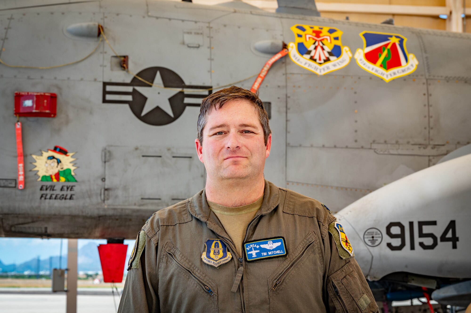 U.S. Air Force Reserve Citizen Airman Lt. Col. Timothy “Scream” Mitchell, an A-10 instructor pilot and flight commander with the 47th Fighter Squadron, stands in front of the first A-10 Thunderbolt II he flew, tail number 9154, at Davis-Monthan Air Force Base, Arizona, Aug. 22, 2024. Mitchell’s dedication to the A-10 community has made him a respected figure among his peers as the aircraft approaches the end of its service. (U.S. Air Force photo by Tech. Sgt. Tyler J. Bolken