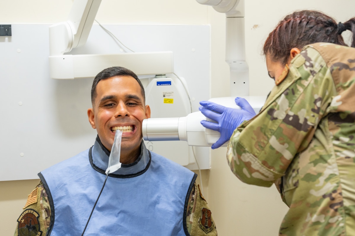 U.S. Airmen assigned to the 156th Wing, complete dental requirements during an exercise Aug. 9, 2024, at Muñiz Air National Guard Base, Carolina, Puerto Rico. The exercise is part of the 125th Medical Group’s training that enhances air-load capabilities, refines pre- and post- deployment procedures, expands mission readiness in an unfamiliar environment, and fulfills Comprehensive Medical Readiness Plan requirements, including critical care, search and extraction, and Air Force Specialty Code proficiency training, while collaborating with the 156th Medical Group. The exercise also includes providing Individual Medical Readiness support for members of the 156th Wing population. (U.S. Air National Guard photo by Senior Airman Jesse Hanson)