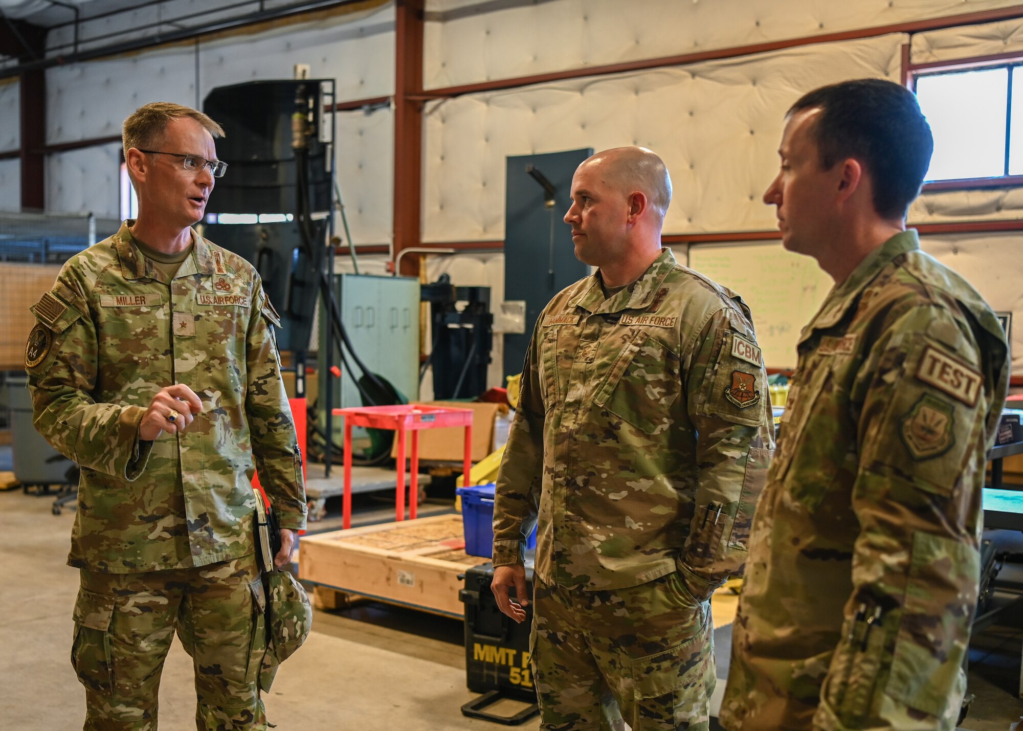 An Air Force Global Strike Command logistics and engineering director, 377th Flight Test Missile Maintenance Squadron generation flight chief and 377th Test and Evaluation Group commander, speak about launch capabilities during a tour of the 377th FTMMXS at Vandenberg Space Force Base.