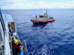 The crew of the USCGC Frederick Hatch (WPC 1143) conduct training with Station Apra Harbor in Apra Harbor on Aug. 8, 2024. The towing exercise with a Station Apra Harbor 45-foot Response Boat-Medium crew enhanced inter-unit coordination and operational proficiency. (U.S. Coast Guard photo)