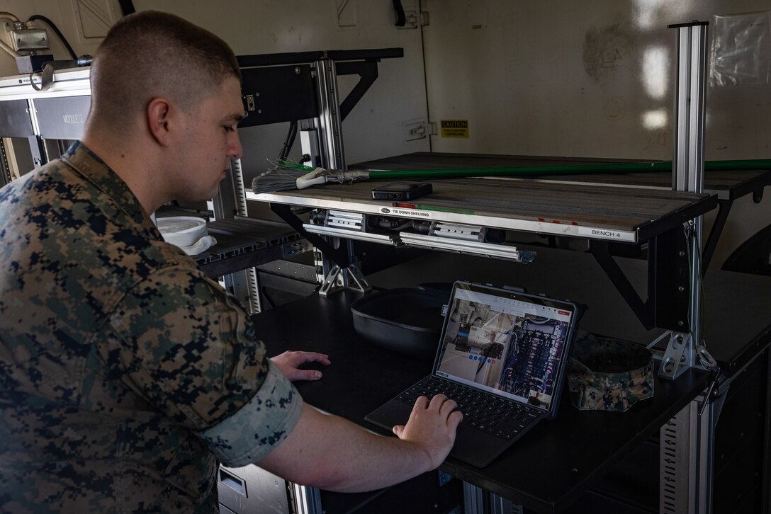U.S. Marine Corps Cpl. Tyler Havard, from Arizona, a ground electronics transmissions systems maintainer with 2nd Maintenance Battalion, 2nd Marine Logistics Group, tests tele-maintenance capabilities at Marine Corps Air Station Cherry Point, North Carolina, Aug. 21, 2024. Marine Depot Maintenance Command is experimenting with augmented reality technology as part of its effort to modernize its maintenance capabilities from industrial-era practices to technologies suitable and capable of meeting the demands of the Information Age. (U.S. Marine Corps photo by Lance Cpl. Orlanys Diaz Figueroa)