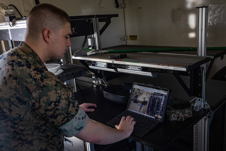 U.S. Marine Corps Cpl. Tyler Havard, from Arizona, a ground electronics transmissions systems maintainer with 2nd Maintenance Battalion, 2nd Marine Logistics Group, tests tele-maintenance capabilities at Marine Corps Air Station Cherry Point, North Carolina, Aug. 21, 2024. Marine Depot Maintenance Command is experimenting with augmented reality technology as part of its effort to modernize its maintenance capabilities from industrial-era practices to technologies suitable and capable of meeting the demands of the Information Age. (U.S. Marine Corps photo by Lance Cpl. Orlanys Diaz Figueroa)