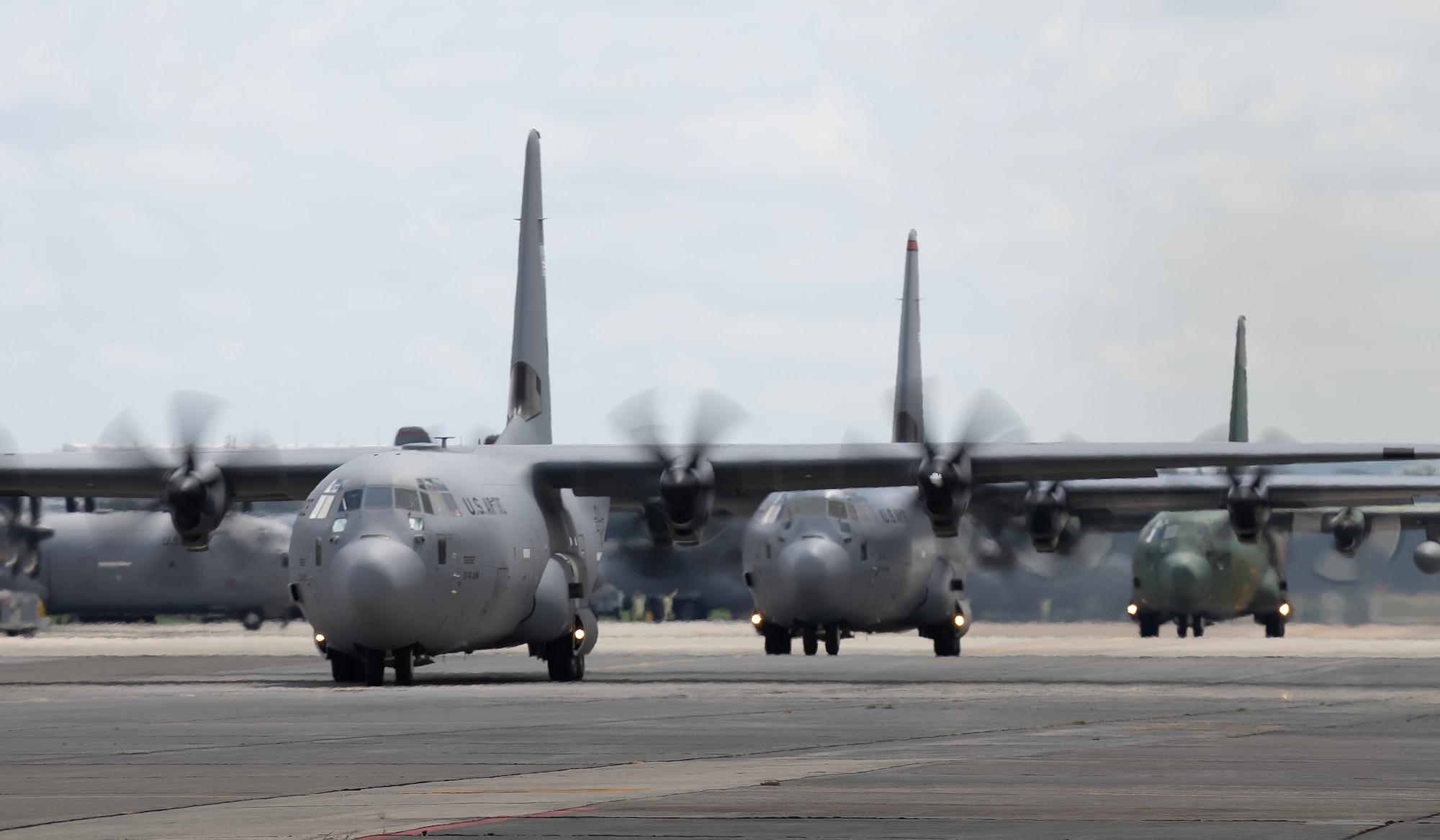 Airplanes align on the runway preparing for a mass generation event.