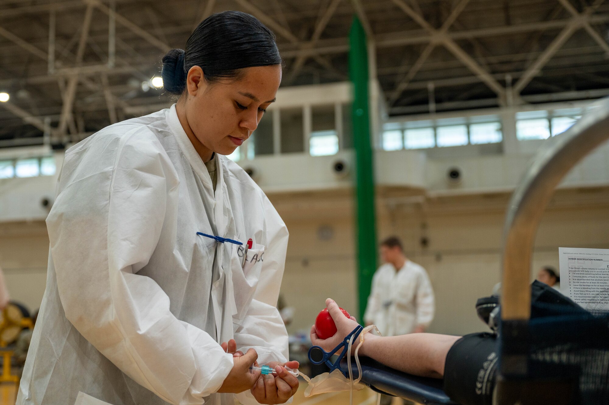 A medic takes blood from patient.