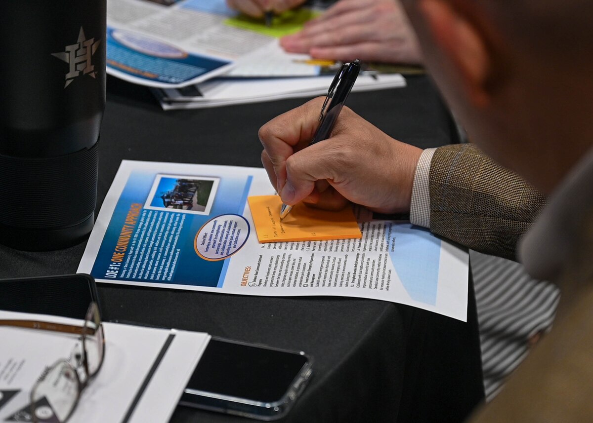 A Senior Leader Summit attendee takes notes at the Powell Event Center, Goodfellow Air Force Base, Texas, Aug 20, 2024. The Senior Leader Summit featured discussions, briefings, and tours to increase familiarity between squadron and group commanders, senior enlisted leaders, and joint service leaders across the wing. (U.S. Air Force Photo by Senior Airman Zach Heimbuch)