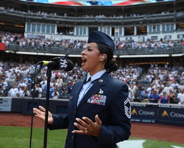 New York Air National Guard Senior Master Sgt. Myra Winnie belts out “God Bless America” during the 7th inning stretch of a New York Yankees game Aug. 10, 2024, at Yankee Stadium in the Bronx.