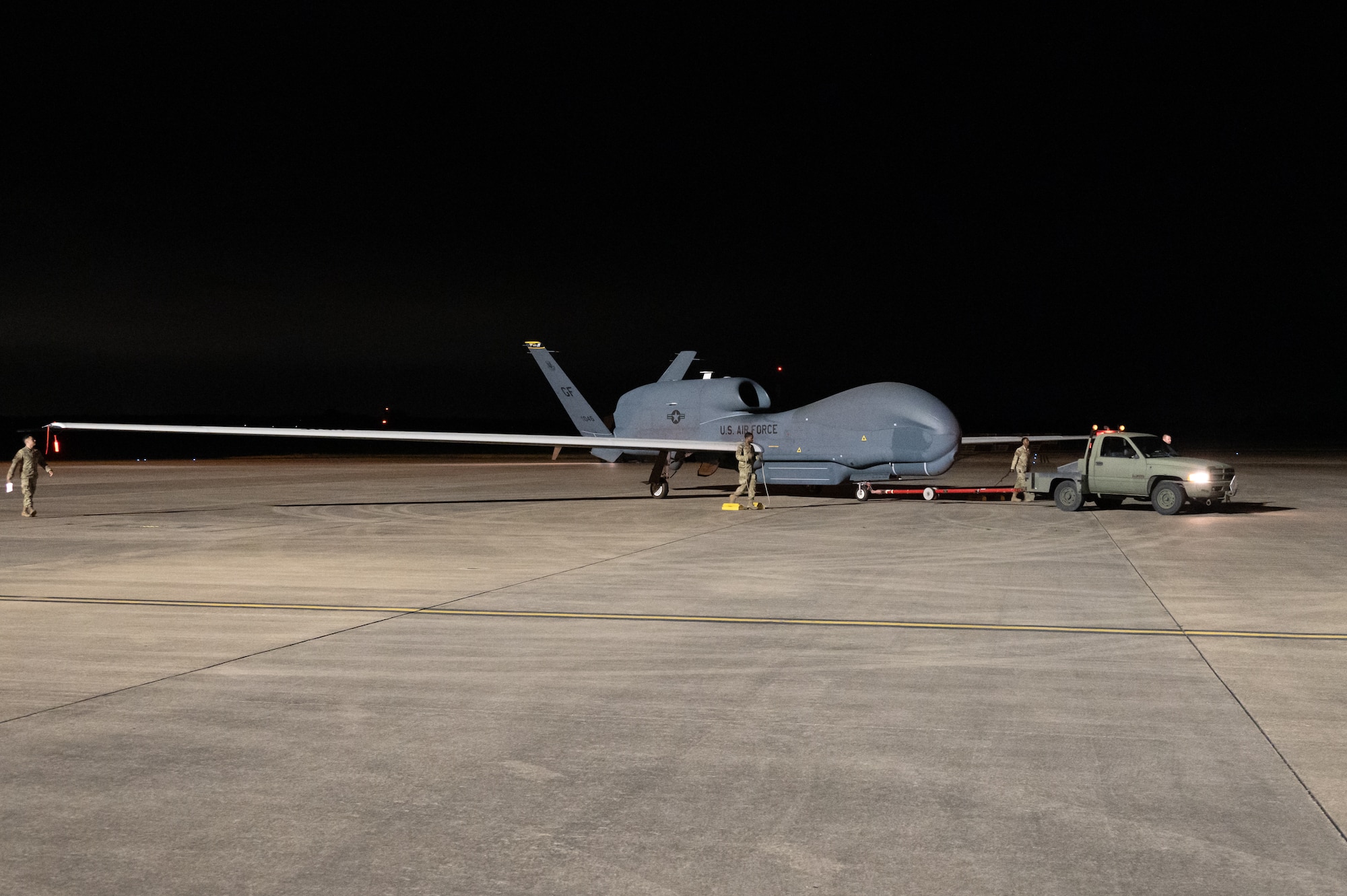 An RQ-4B Global Hawk assigned to Grand Forks Air Force Base’s 319th Reconnaissance Wing is towed from the flightline.