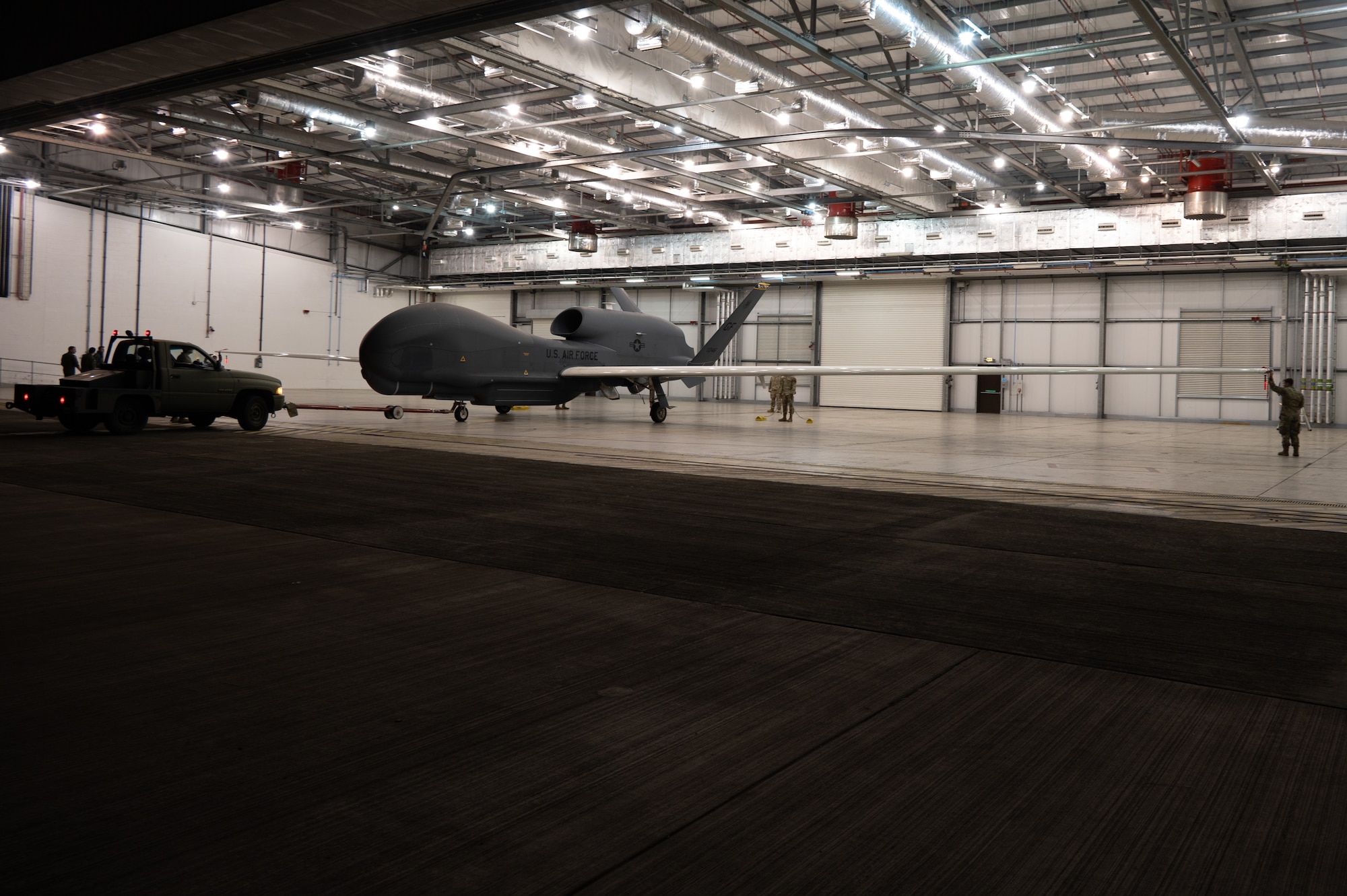 An RQ-4B Global Hawk assigned to Grand Forks Air Force Base’s 319th Reconnaissance Wing arrives at a hangar at RAF Fairford.