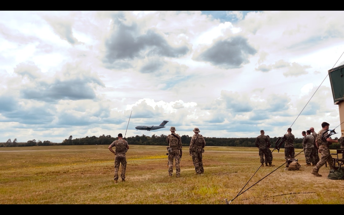 Military personnel standing on a field