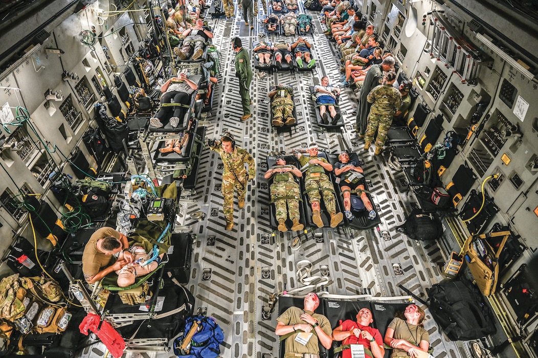 A 445th Airlift Wing C-17 Globemaster III is loaded with mock patients during a multi-unit mass casualty exercise at Wright-Patterson Air Force Base, Ohio, Aug. 3, 2024. The exercise included members of the 445th Aeromedical Staging, Aerospace Medicine and Aeromedical Evacuation Squadrons. (U.S. Air Force photo/Master Sgt. Patrick O’Reilly)