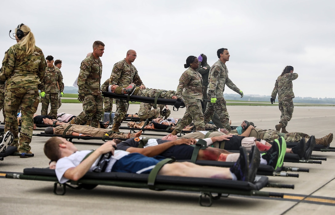 Members of the 445th Aeromedical Staging Squadron, carry a litter to a staging site during a mass casualty exercise at Wright-Patterson AFB, Ohio, Aug. 3, 2024. (U.S. Air Force photo/Senior Airman Angela Jackson)