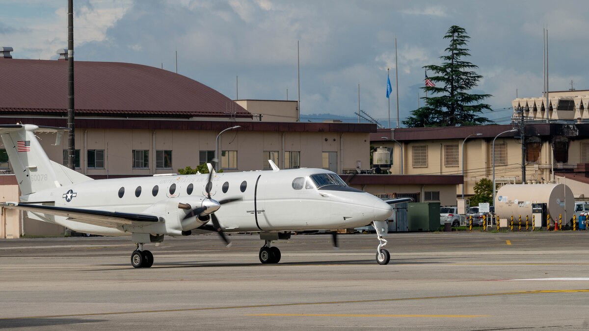 A plane taxis down flightline.