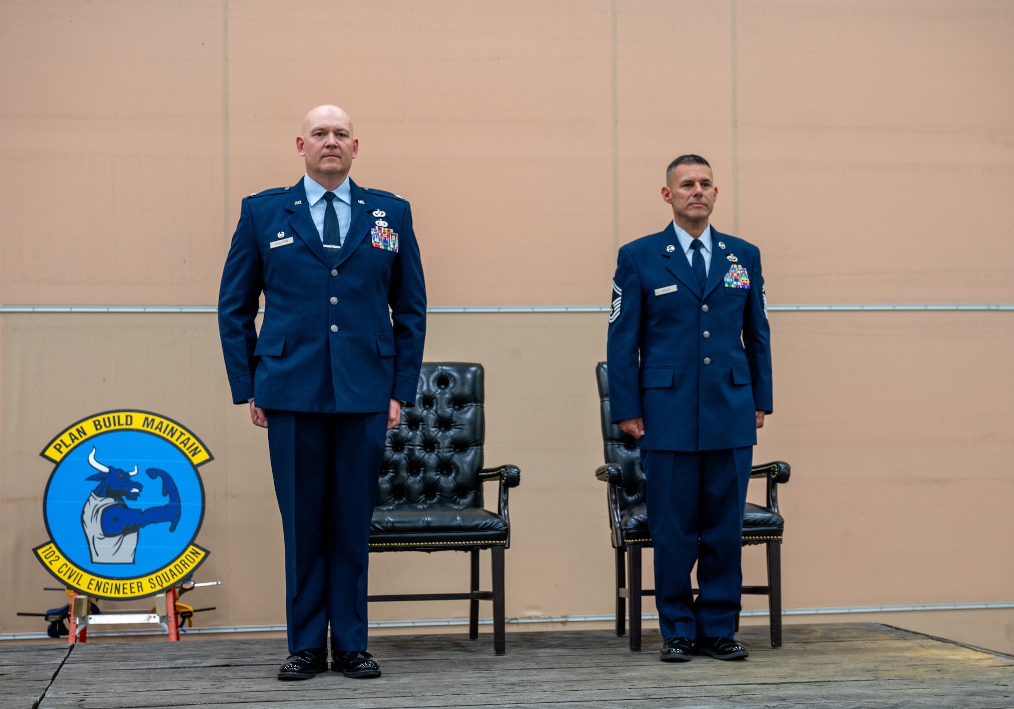 Airmen stand at attention.