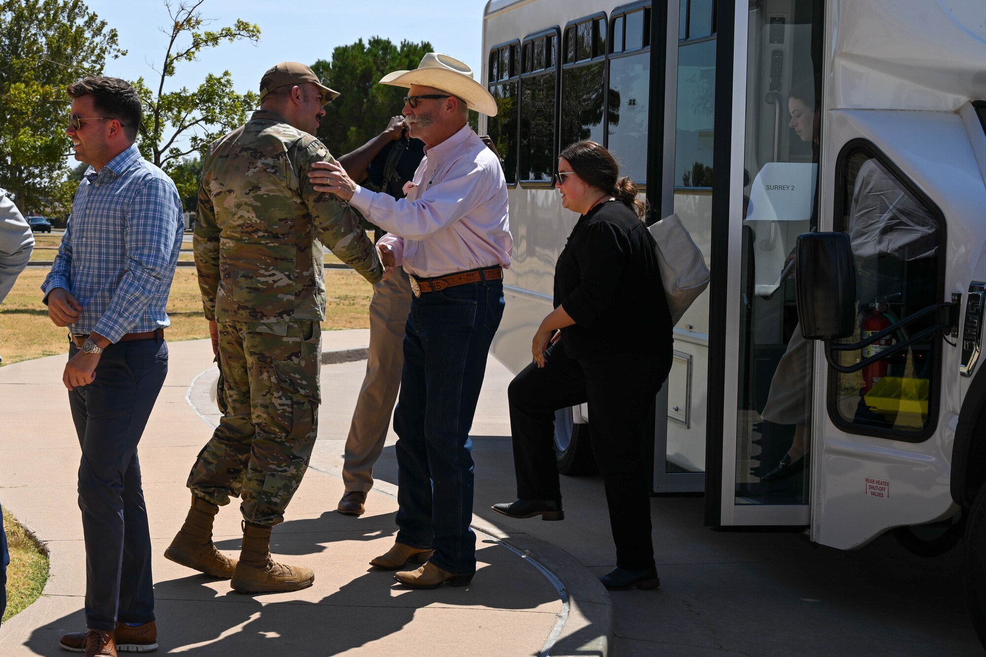 U.S. Air Force Chief Master Sgt. Justin Brundage, 97th Air Mobility command chief, greets Steve Carson, field representative for U.S. Senator James Lankford, and other U.S. Congressional staff delegates at Altus Air Force Base, Oklahoma, Aug. 21, 2024. The delegates witnessed the base’s training mission first-hand and to discuss installation improvements. (U.S. Air Force photo by Senior Airman Miyah Gray)