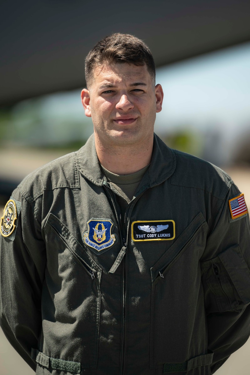 a portrait photo of a U.S. Airman on the flight line.