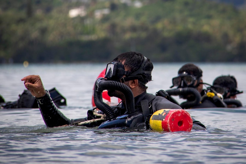 Divers orient themselves during a military exercise.