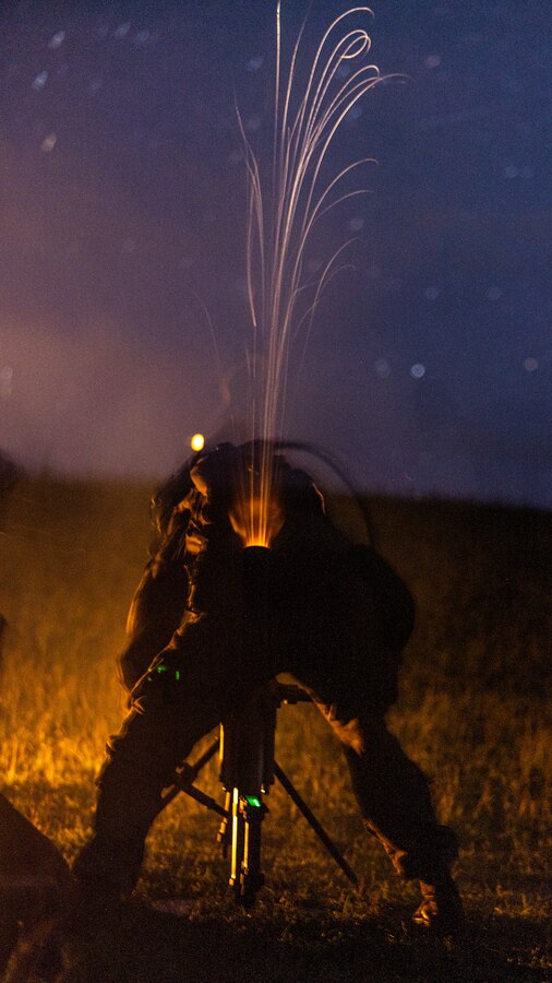 U.S. Marines with 3rd Battalion, 6th Marine Regiment, 2d Marine Division fire an M224 60mm mortar during a platoon attack range on Camp Lejeune, North Carolina, Aug. 21, 2024. This two week-long exercise promoted a comprehensive warfighting ability and trained the next generation of combat ready forces. (U.S. Marine Corps photo by Lance Cpl. Brian Bolin Jr.)