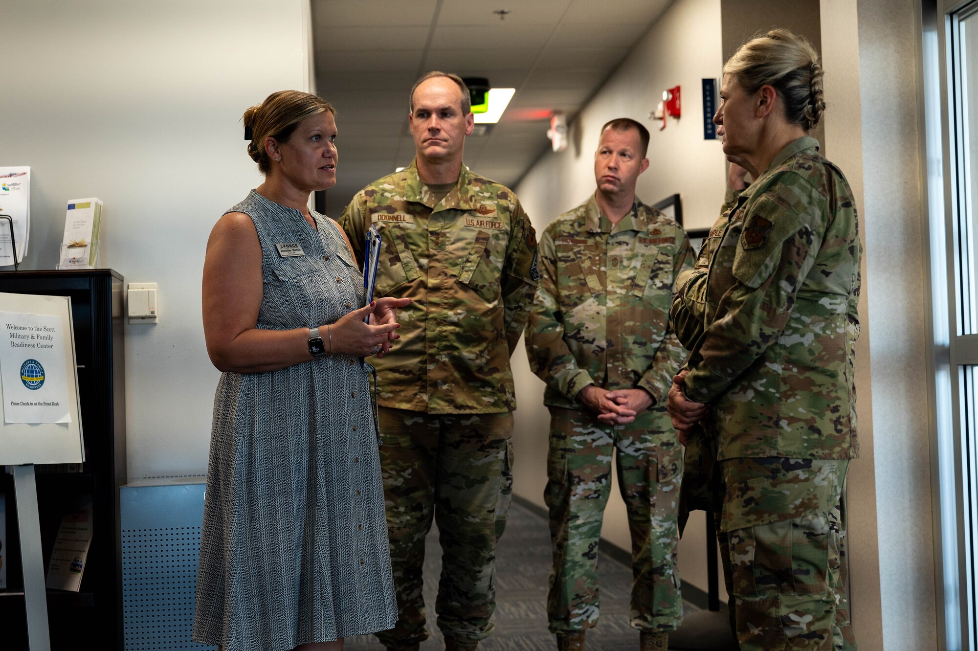 group gather in hallway to speak