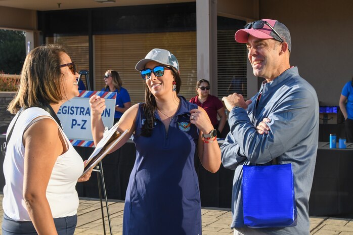 U.S. Air Force Col. Charles Hansen, 9th Mission Support Group commander, talks with Kellie Sheeran of the Beale Military Liaison Council (BMLC) at the annual Patriotic Golf Tournament in Marysville, California, Aug. 23, 2024.