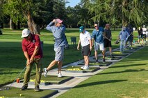 Golfers warm up for the annual Patriotic Golf Tournament in Marysville, California, Aug. 23, 2024.