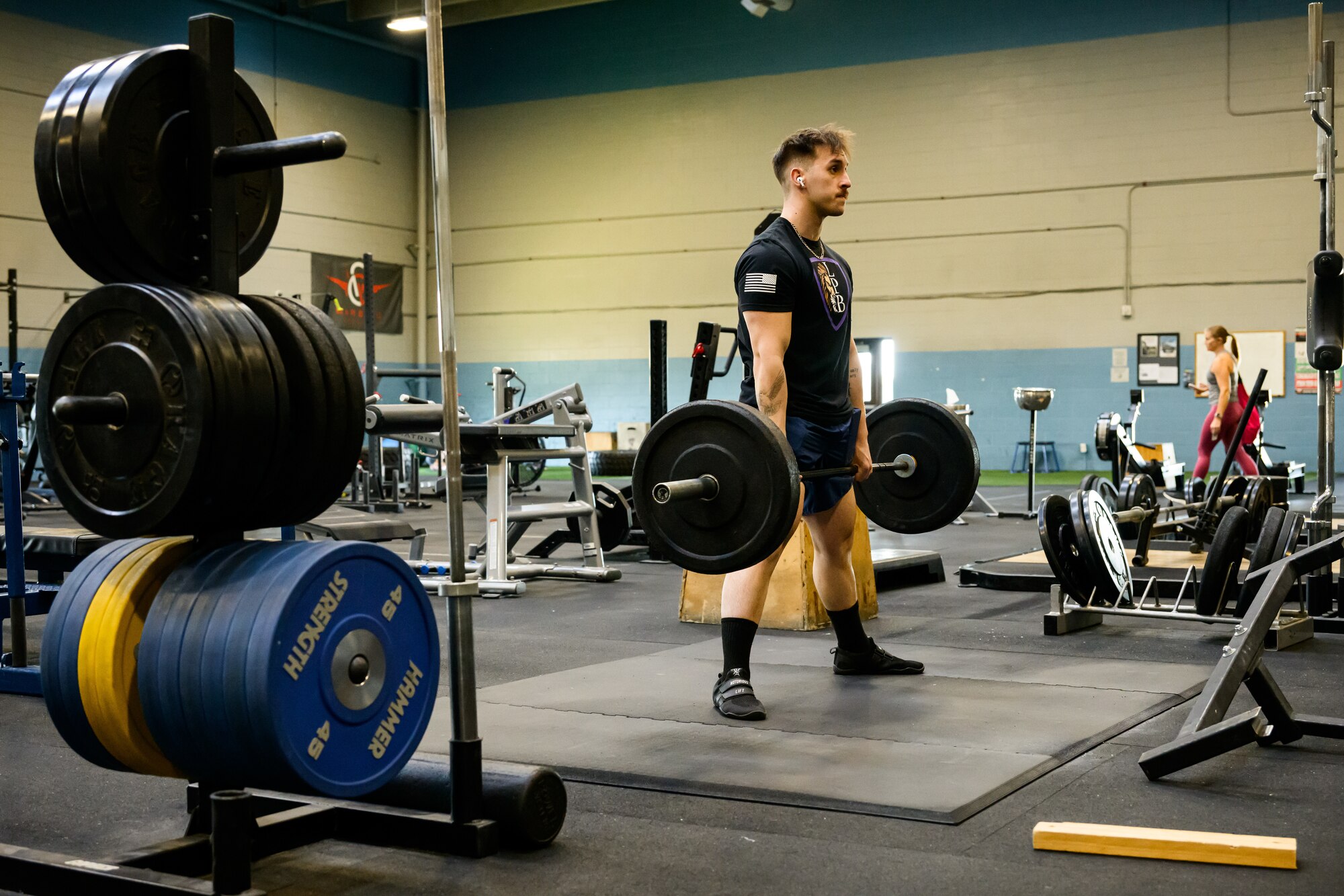 Senior Airman Brandon Higgins, 388th Maintenance Group, works out with weights at Hill Air Force Base. Higgins is preparing to compete in the World Powerlifting Congress World Cup. (U.S. Air Force photo by R. Nial Bradshaw)