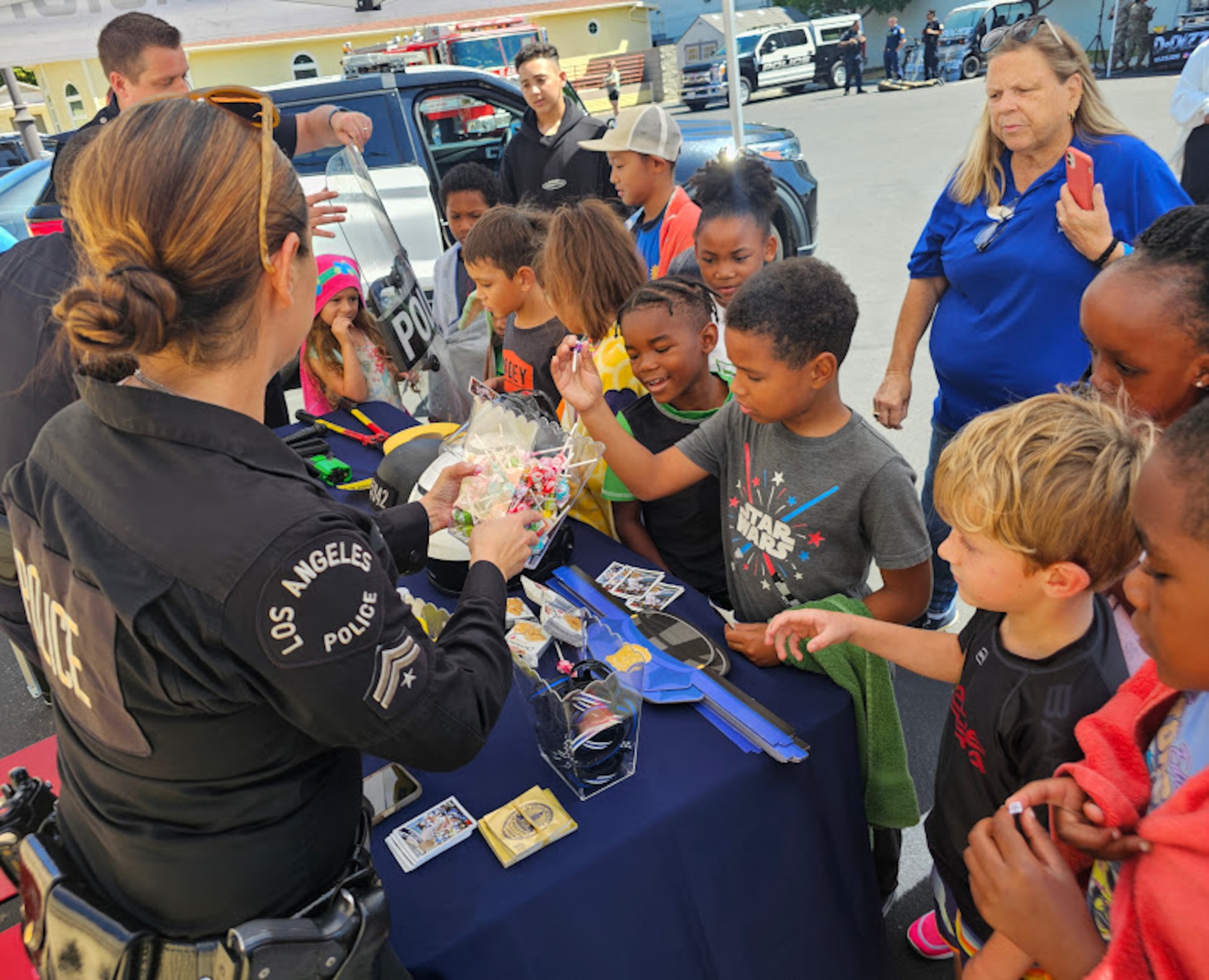 Officers from Los Angeles Police Department to about their jobs and hand out candy to military kids.