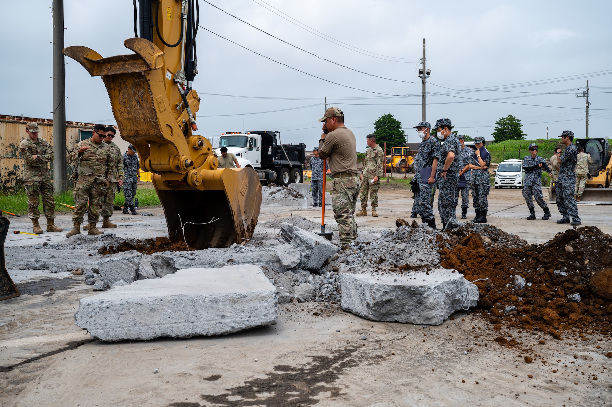 Airmen assigned to the 374th Civil Engineer Squadron and members of the Japan Air Self-Defense Force participate in a Rapid Airfield Damage Recovery exercise at Yokota Air Base, Japan.