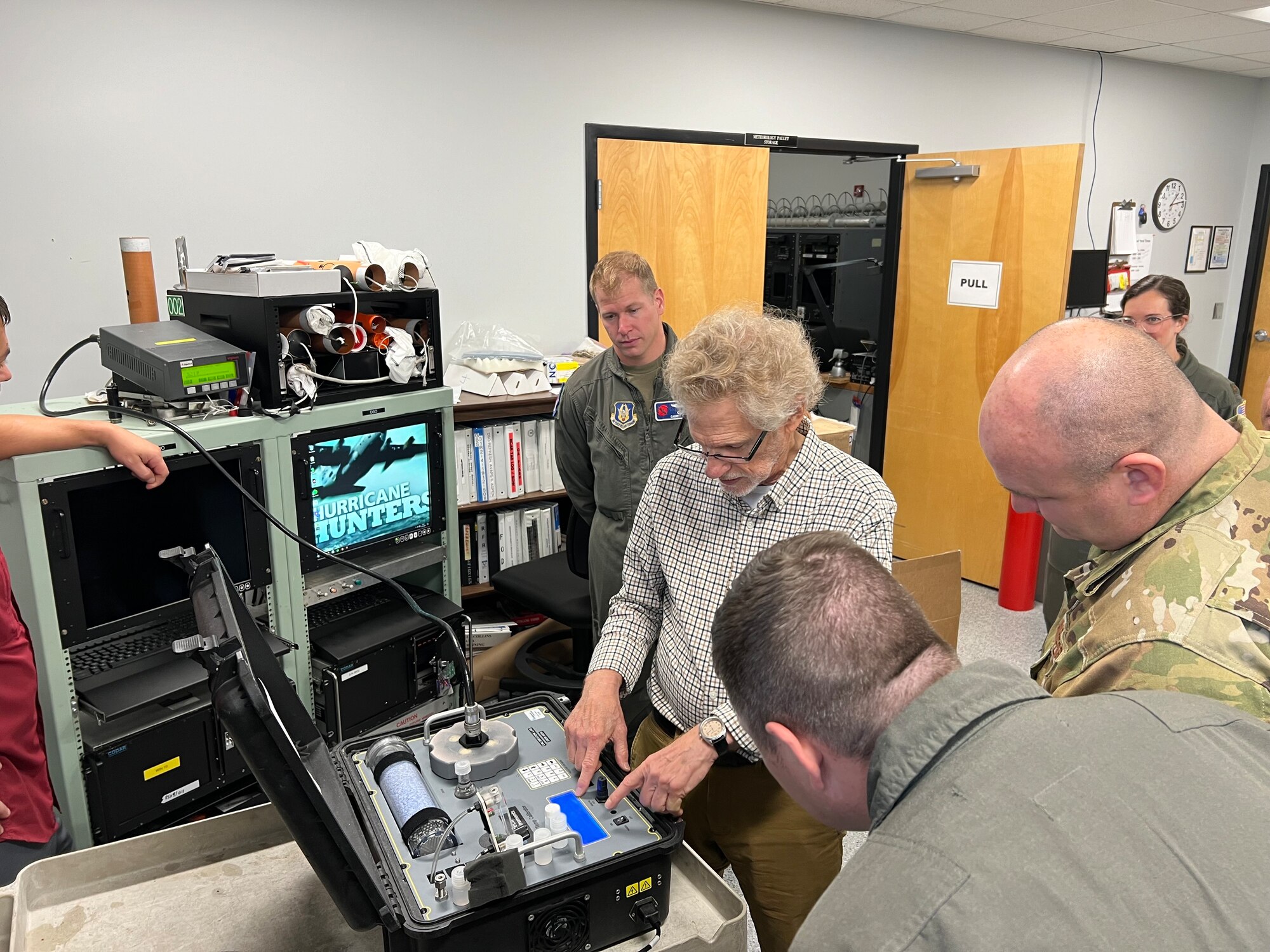 Contractor trains military members while updating equipment.